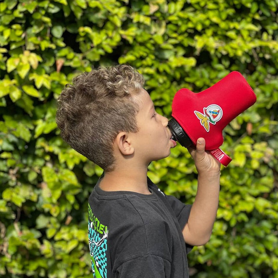 boy drinking from benfica bottle